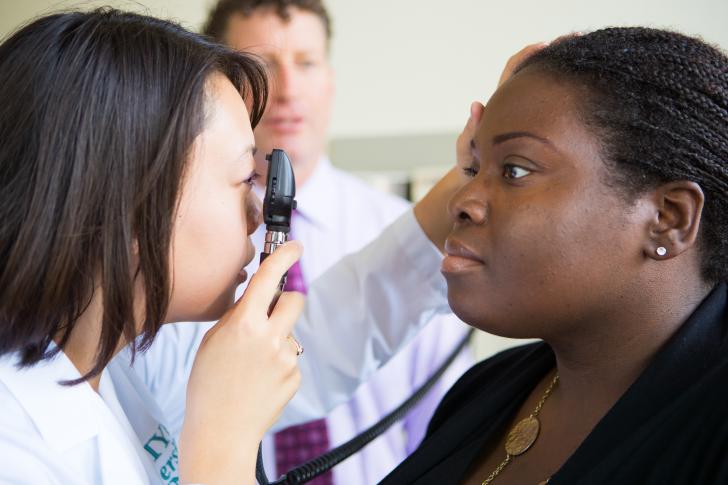 clinician doing eye exam