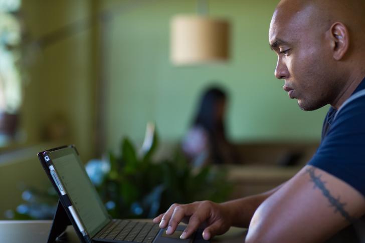 student looking at computer working