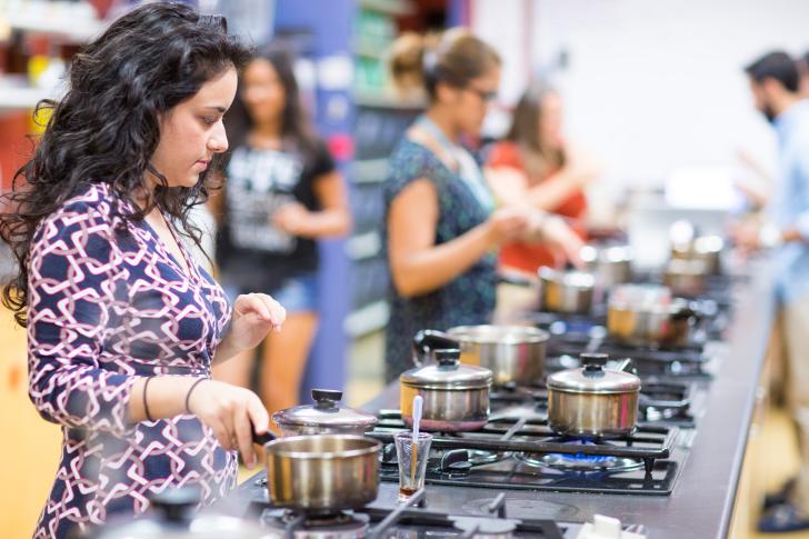 person cooking in classroom