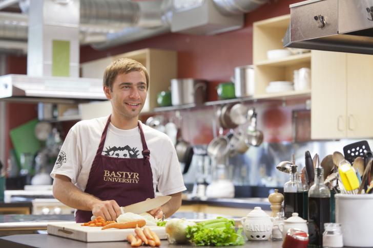 man cooking in a kitchen