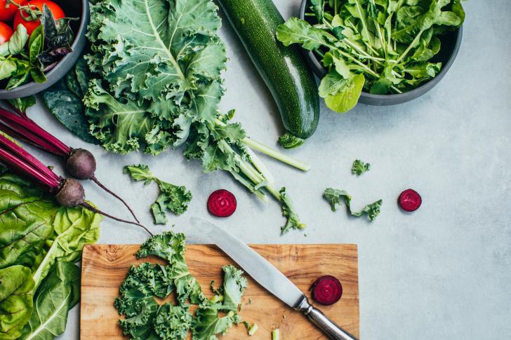 beet and kale on cutting board
