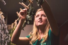 woman drying out herbs